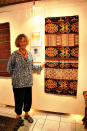 The queen's treasure: Jean Howe and one of her favorite textiles, given by Rambu Eti, a queen of the kingdom of Pau, East Sumba. (