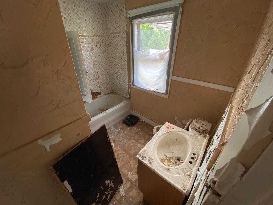bathroom with pills on counter in detroit land bank authority house