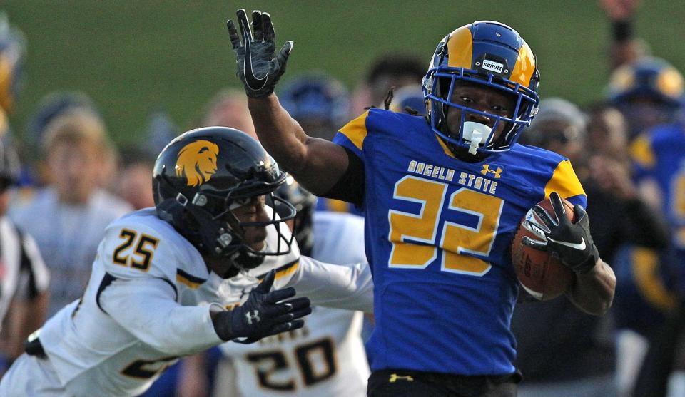 Alfred Grear (22) rushes the ball for Angelo State University during a game against Texas A&M-Commerce on Saturday, Nov. 6, 2021.