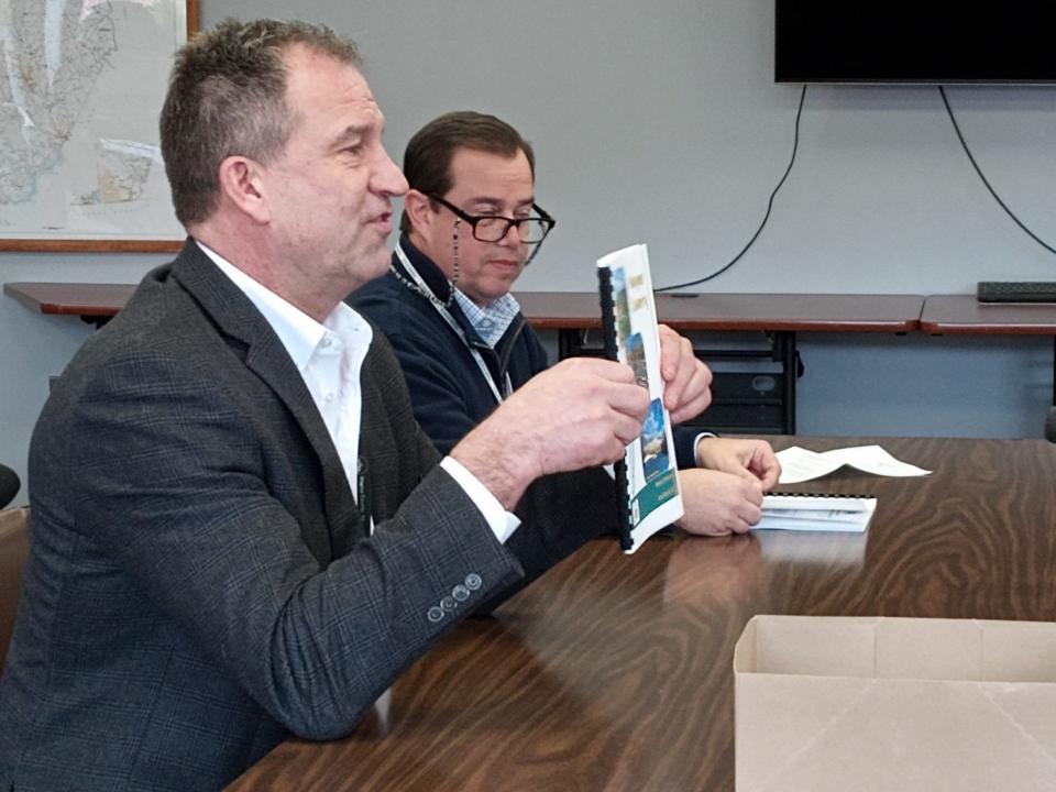 Wayne County Planning Director Craig Rickard discusses the newly completed 2023 Planning Commission Annual Report at the Feb. 22, 2024, commissioners' meeting. Seated next to him is Assistant Director Christopher J. Barrett.