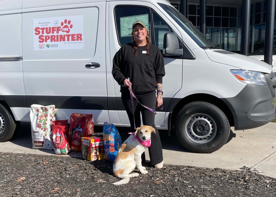 Hannah Joyner, Community Outreach Manager for the Humane Society Tennessee Valley, with adoptable dog Bailey at the inaugural Stuff the Sprinter for Homeless Pets event held at Mercedes-Benz of Knoxville on 10131 Parkside Drive on Nov. 11, 2023.
