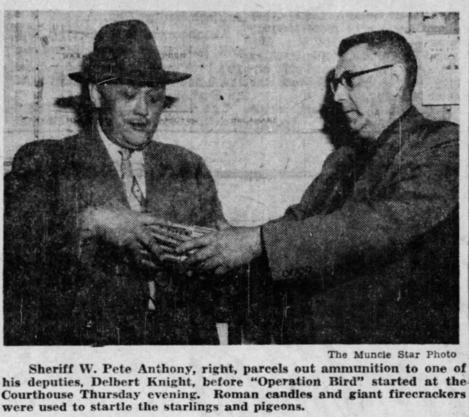 Sheriff Anthony (right) passes Roman candles to one of his ‘raiders” just before battle in December 1952.