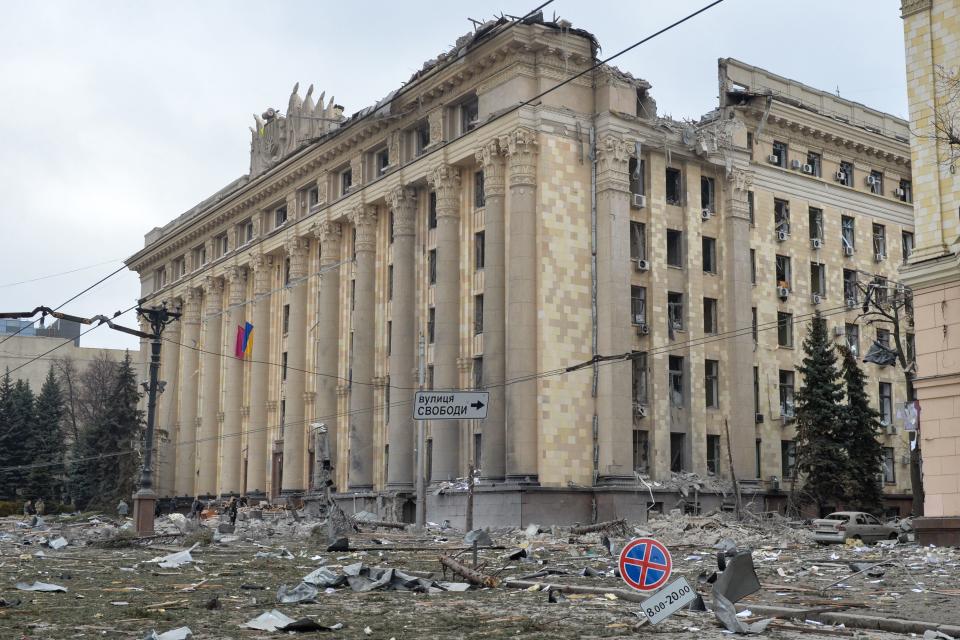 TOPSHOT - This general view shows the damaged local city hall of Kharkiv on March 1, 2022, destroyed as a result of Russian troop shelling.   The central square of Ukraine's second city, Kharkiv, was shelled by advancing Russian forces who hit the building of the local administration, regional governor Oleg Sinegubov said. Kharkiv, a largely Russian-speaking city near the Russian border, has a population of around 1.4 million. / AFP / Sergey BOBOK