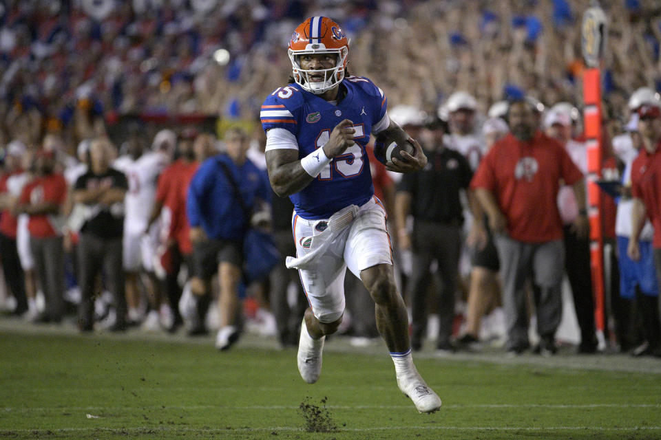 Florida quarterback Anthony Richardson (15) rushes for a 45-yard touchdown during the first half of an NCAA college football game against Utah, Saturday, Sept. 3, 2022, in Gainesville, Fla. (AP Photo/Phelan M. Ebenhack)