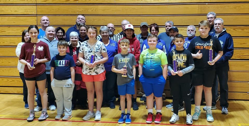 Volunteers and participants pose for a picture at the conclusion of the annual Lodge Hoop Shoot in Rochester.