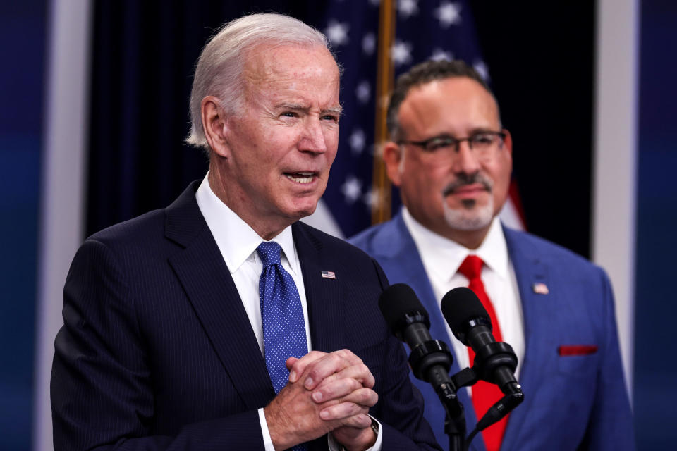 President Joe Biden speaks about student debt relief alongside Secretary of Education Miguel Cardona on Oct. 17, 2022, in Washington. (Alex Wong / Getty Images)