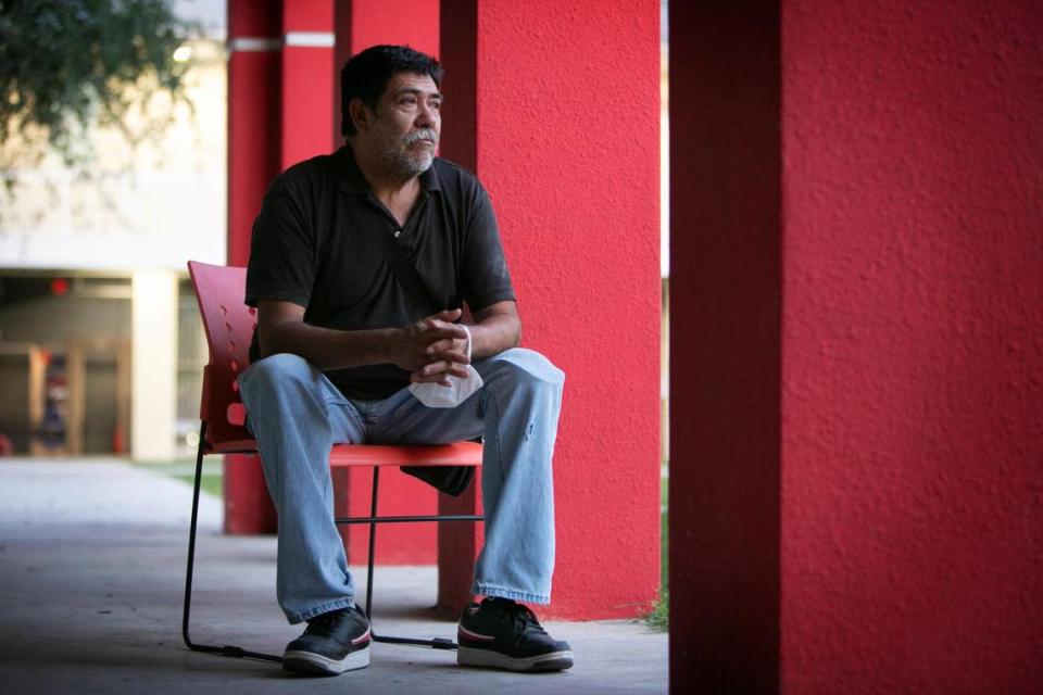 Roberto Jauregui, 59, holds back tears as he talks about losing his wife to COVID-19, having his leg amputated after an industrial accident and living in a shelter with his grandsons.