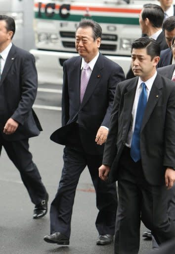 Former Democratic Party of Japan leader Ichiro Ozawa (centre) arrives at the Tokyo District Court. Ozawa, one of the most powerful men in Japanese politics, has been found not guilty of a major funding scandal