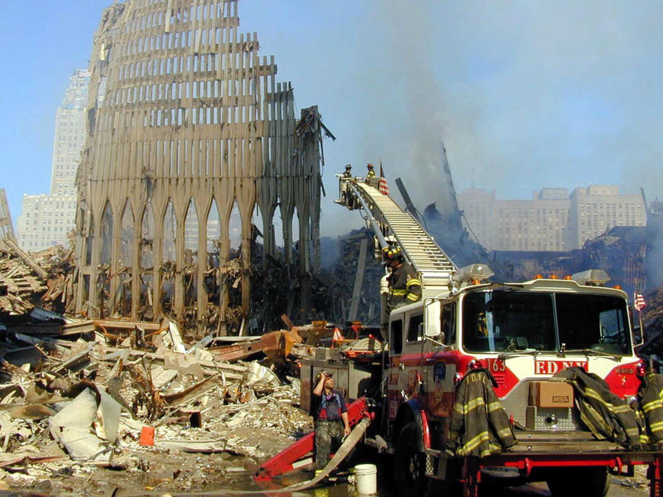 <p>Remains of the facade of 2 World Trade Center is all that stands on the World Trade Center site on Sept. 12, 2001. (Photo: AP) </p>