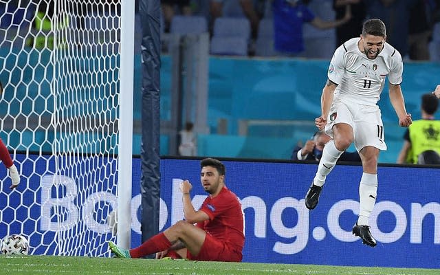 Turkey defender Merih Demiral, left, scored an unfortunate own goal, to the delight of Italy forward Domenico Berardi