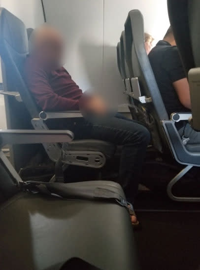 A passenger captured a photo of the man urinating in his seat. Photo: Supplied