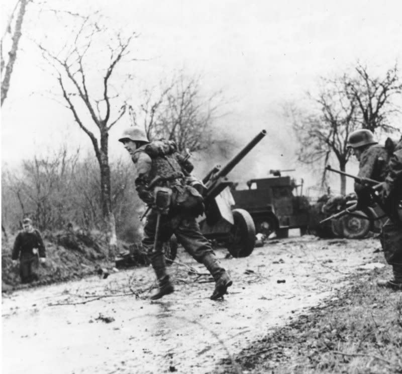 Panzergrenadier-SS Kampfgruppe Hansen in action during clashes in Poteau, Belgium, against Task Force Myers, on December 18, 1944, as part of the Battle of the Bulge. File Photo courtesy the U.S. National Archives and Records Administration