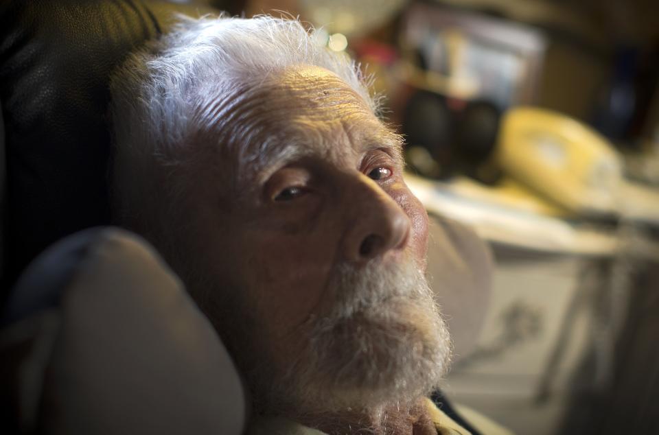 111-year-old Dr. Alexander Imich the world's oldest living man poses for a photograph during an interview with Reuters at his home on New York City's upper west side, May 9, 2014. Dr. Imich, who holds a Ph.D. in Zoology, was born in Poland on February 4,1903, fled Poland when the Nazis took over in 1939, survived a slave labor camp in Russia and moved to the United States in 1951 where he became an author on parapsychology. REUTERS/Mike Segar (UNITED STATES - Tags: SOCIETY HEADSHOT PORTRAIT)