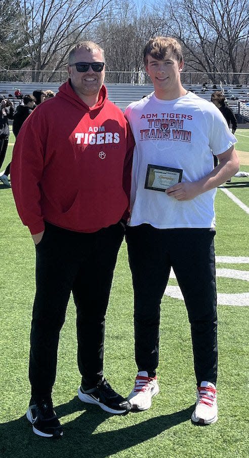 ADM's Drew Hickey poses for a photo after breaking a school record in the discus on Saturday, April 6, 2024, in Iowa City.