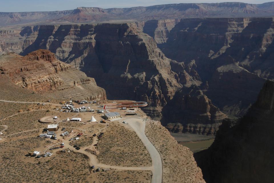 The man was reportedly about 90 metres from the Skywalk glass platform, which hangs over the Grand Canyon, when he slipped and fell over the edge. Source: AP Photo/Ross D. Franklin, File