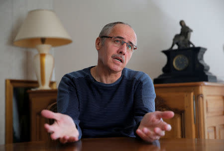 Jean-Marc Fleury, opponent to the project of an underground nuclear waste disposal of the French National Radioactive Waste Management Agency ANDRA in the village of Bure called CIGEO, talks to Reuters journalists during an interview at his home in Verney, France, April 6, 2018. Picture taken April 6, 2018. REUTERS/Vincent Kessler