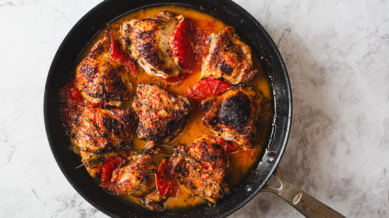 Chicken in pan with sauce