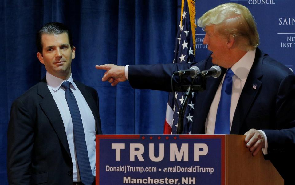 Donald Trump Jr on the campaign trail with his father in November 2015 - Credit: Reuters