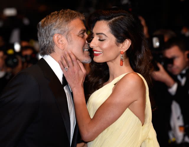 George Clooney and his wife Amal Clooney. Photo by Clemens Bilan/Getty Images.