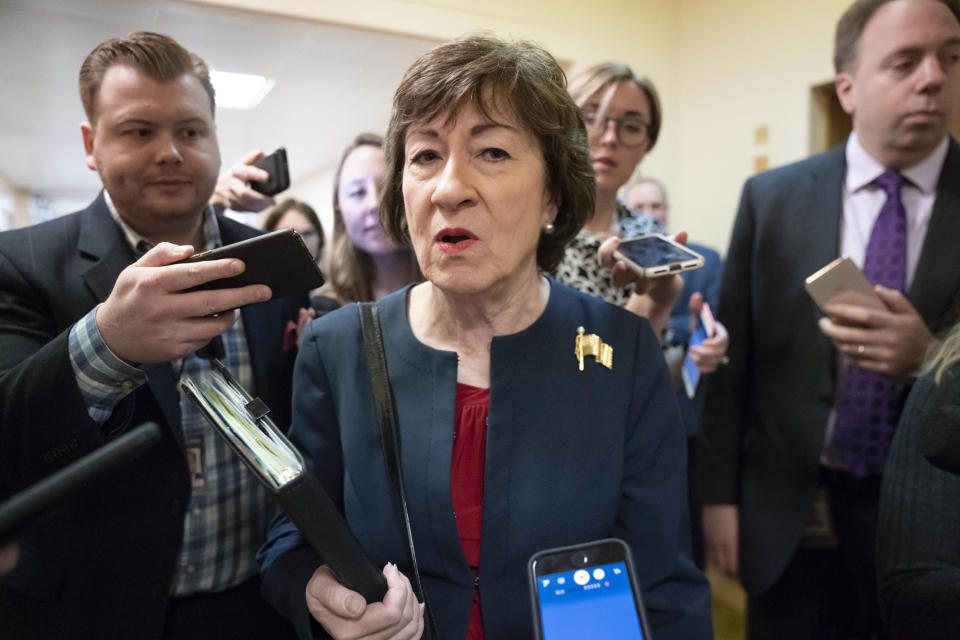 Sen. Susan Collins, R-Maine, is surrounded by reporters as she heads to vote at the Capitol in Washington, Wednesday, Nov. 6, 2019. (AP Photo/J. Scott Applewhite)