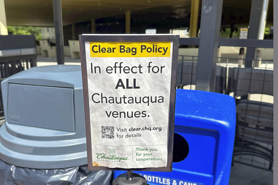 A sign on the grounds of the Chautauqua Institution warns of new security policies, in Chautauqua, N.Y., Thursday, June 29, 2023. Visitors say they notice more security people and protocols at events. Amphitheater patrons can now bring only clear bags inside, for example, and may be wanded or asked to walk through a weapons detector. (AP Photo/Carolyn Thompson)
