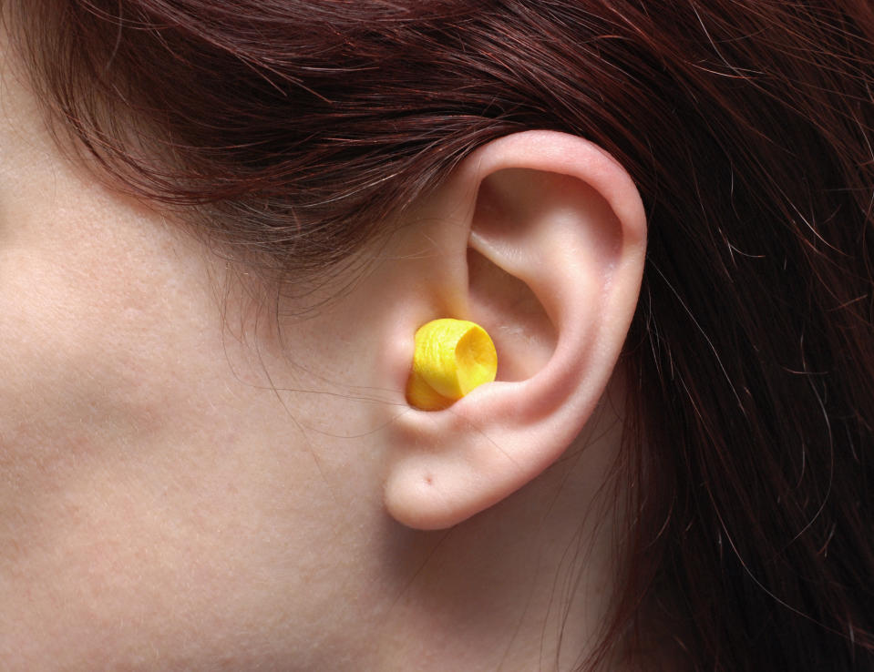 <em>Wearing earplugs won’t block out the music, but will protect your hearing, the charity says (Picture: Getty)</em>