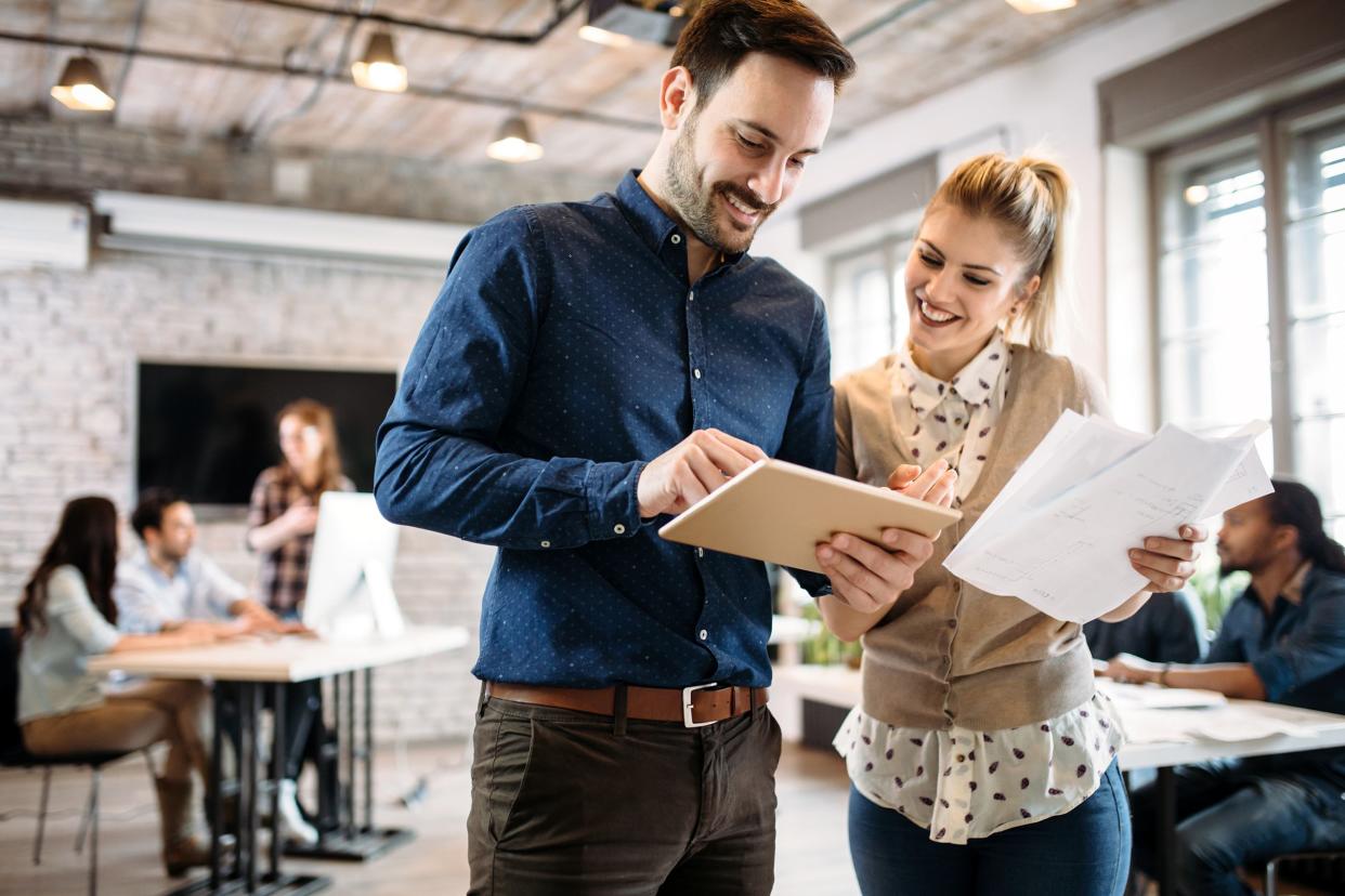 two people having a discussion in hip office