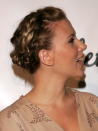 <p>Scarlett Johansson integrates a french braid into her pretty up-do.</p>