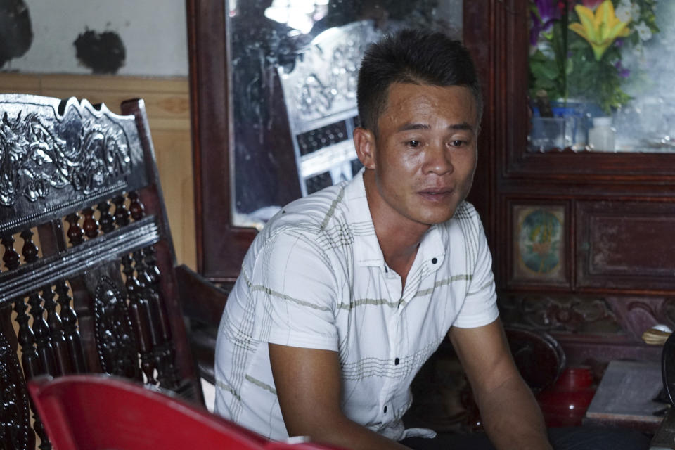 Vo Ngoc Chuyen, brother of Vo Ngoc Nam, speaks to media at his home in Yen Thanh district, Nghe An province, Vietnam Sunday, Oct. 27, 2019. Chuyen's family fear that Vo Ngoc Nam could be among the people who died in a container in U.K. (AP Photo/Linh Do)