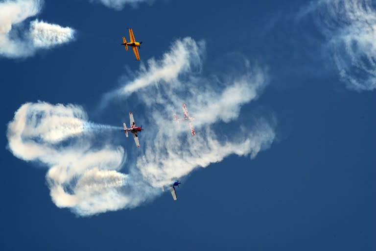 <p>Aircraft from Britain’s Global Stars Aerobatic team perform a display routine as they take part in the second day of a three day airshow in Ahmedabad on April 30, 2016. </p>