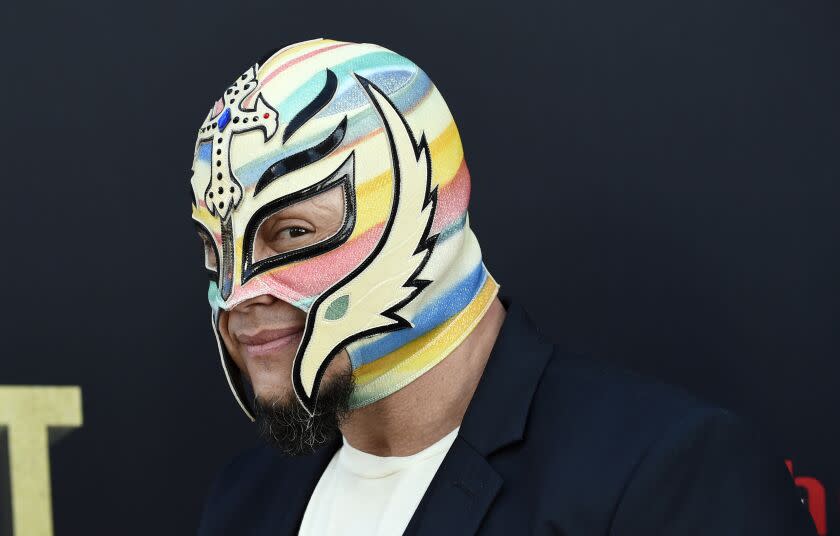 FILE - Professional wrestler Rey Mysterio poses at the premiere of the HBO documentary film "Andre the Giant" at the ArcLight Hollywood on Thursday, March 29, 2018, in Los Angeles. Mysterio was revealed Thursday, Jan 20, 2022, as the cover star of the WWE 2K22 video game. (Photo by Chris Pizzello/Invision/AP)