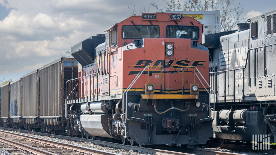 Image shows locomotives, freight trains, railroad tracks