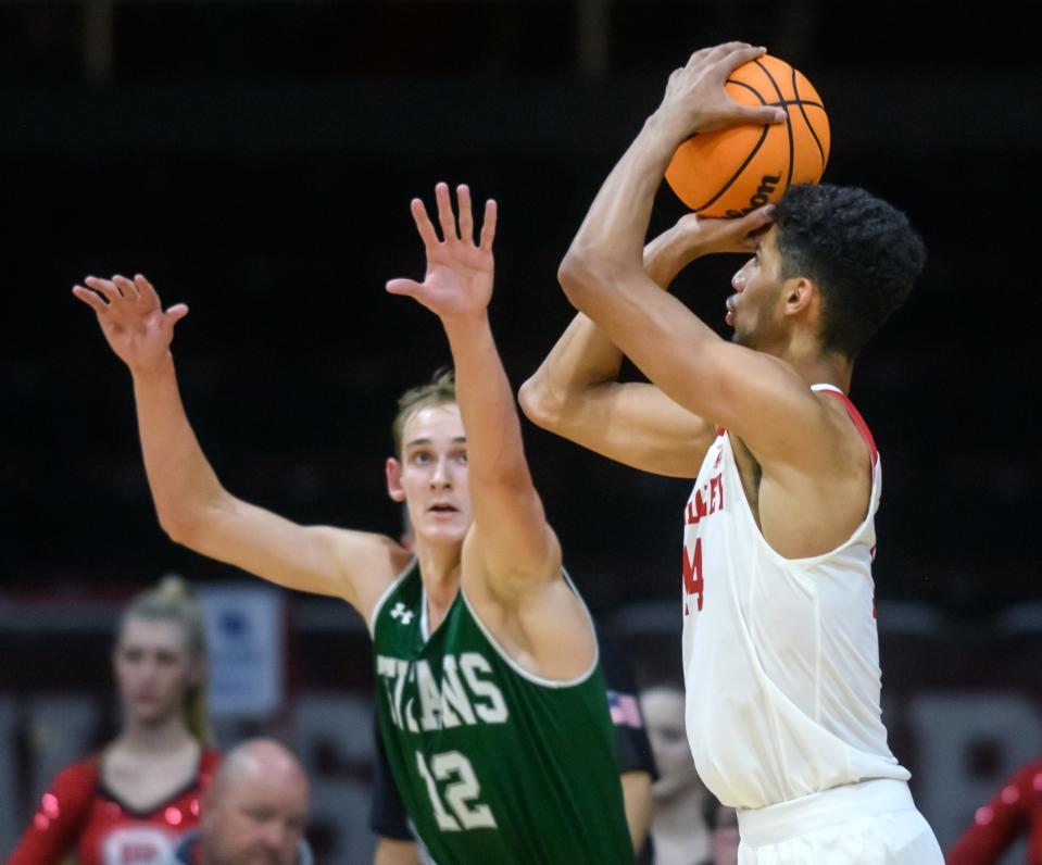 Bradley's Malevy Leons takes a shot against Illinois Wesleyan's Nick Roper in the second half of their exhibition game Wednesday, Nov. 2, 2022 at Carver Arena.