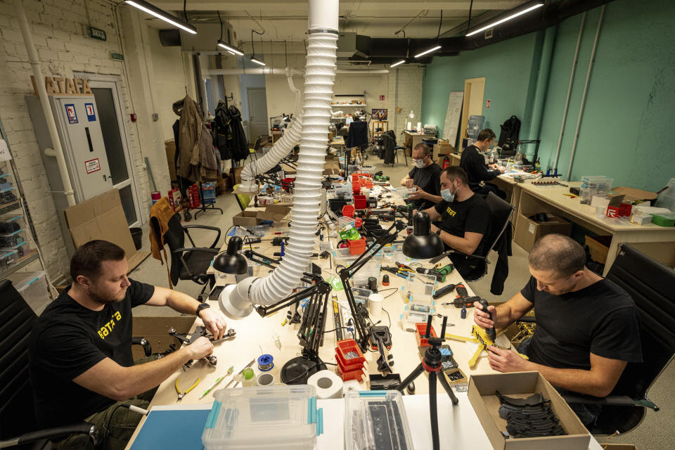 Engineers install components on exploding drones in Kyiv region, Ukraine, on Wednesday, February 7, 2024. (AP Photo/Evgeniy Maloletka)