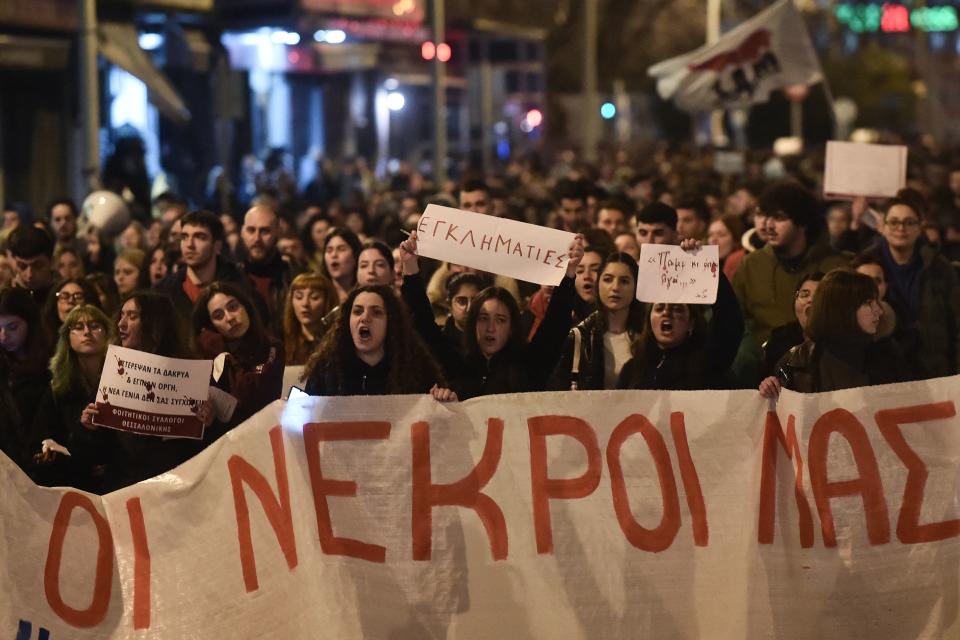 Students hold banners and shout slogans as they take part in a demonstration in Thessaloniki on March 3, 2023, following a deadly train accident near the city of Larissa, where at least 57 people, most of them students, lost their lives. - Thousands of Greek students staged sit-ins and demonstrated in Athens and other cities on March 3 to demand justice for the victims of the train tragedy, which occured on February 28, as authorities admitted failures overseeing the rail network. In Athens, over 5,000 people gathered outside the headquarters of Greek rail operator Hellenic Train to voice anger and sorrow over the country's worst-ever rail disaster. (Photo by Sakis MITROLIDIS / AFP) (Photo by SAKIS MITROLIDIS/AFP via Getty Images)