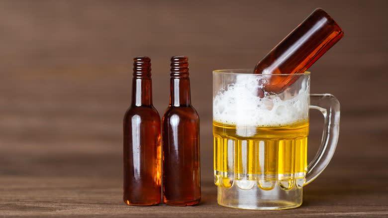 empty bottles in beer glass