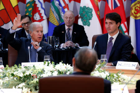 U.S. Vice President Joe Biden (L) speaks during the First Ministers’ meeting with Canada's Prime Minister Justin Trudeau in Ottawa, Ontario, Canada, December 9, 2016. REUTERS/Chris Wattie
