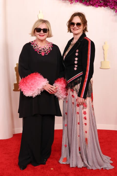 HOLLYWOOD, CALIFORNIA – MARCH 10: (L-R) Sarah Greenwood and Katie Spencer attend the 96th Annual Academy Awards on March 10, 2024 in Hollywood, California. (Photo by John Shearer/WireImage)