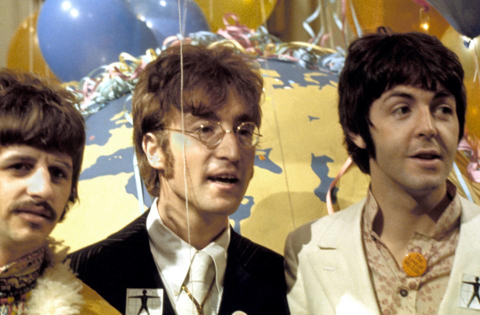 Ringo Starr, John Lennon, and Paul McCartney at a news conference on June 24, 1967. (Photo: Cummings Archives/Redferns)