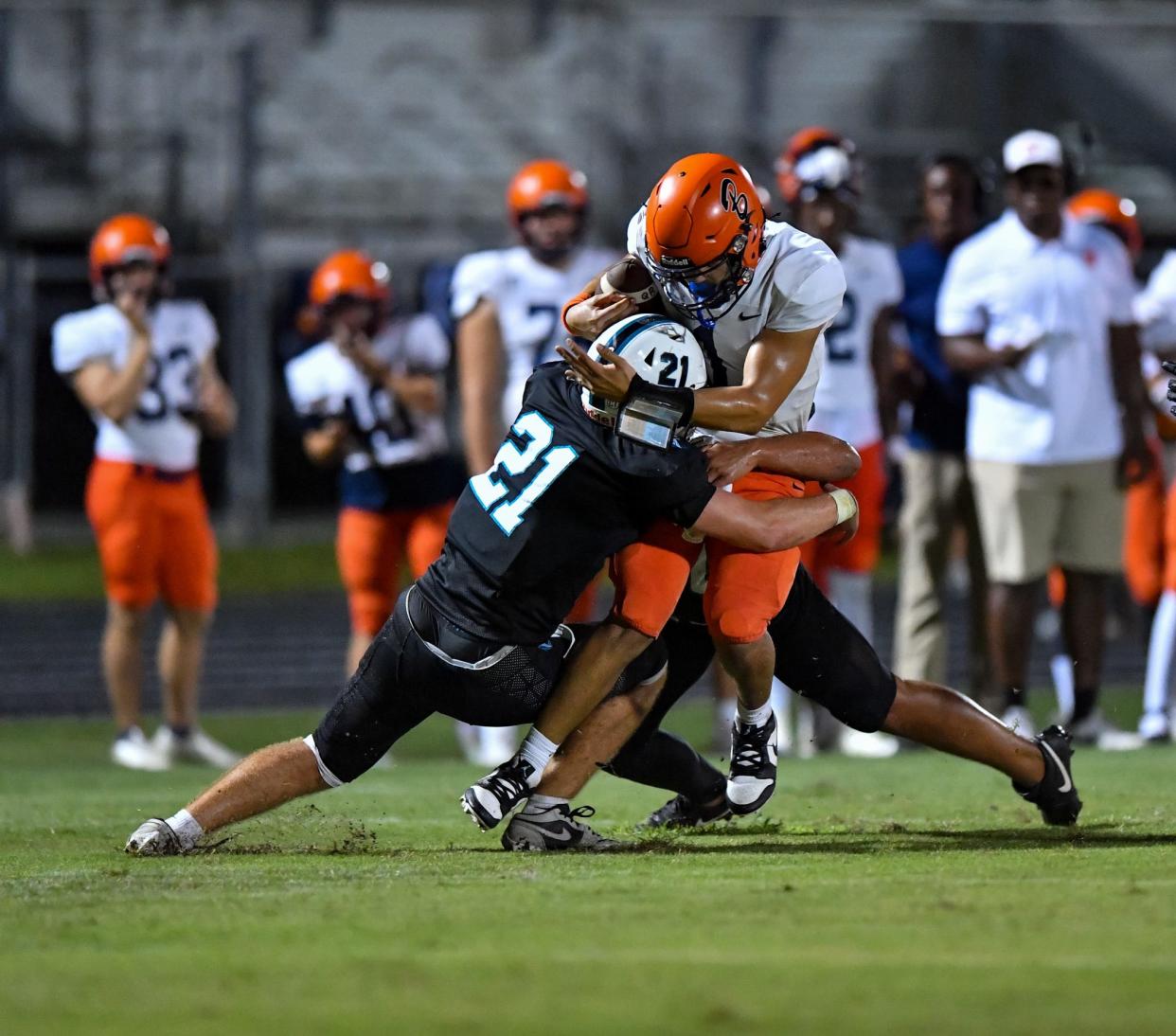 Jensen Beach's Easton Scott (21) makes a tackle against Benjamin in a high school football game, Thursday, Sept. 21, 2023.