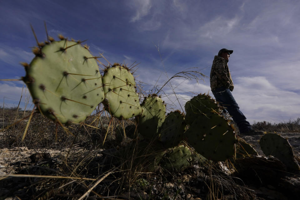 Monarch Ranch manager Doug Meyer overlooks a bat cave on the property near Del Rio, Texas, Thursday, Feb. 16, 2023. Some landowners along the Devil's River argue that proposed wind turbines would kill birds, bats and disrupt monarch butterflies migrating to Mexico and impact ecotourism, a main source of income for many. (AP Photo/Eric Gay)