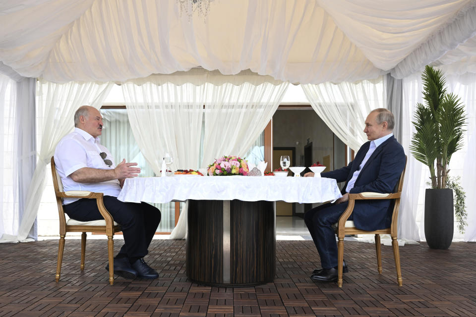 Russian President Vladimir Putin, right, and Belarusian President Alexander Lukashenko talk during their meeting at the Bocharov Ruchei residence in the resort city of Sochi, Russia, Friday, June 9, 2023. (Pavel Bednyakov, Sputnik, Kremlin Pool Photo via AP)