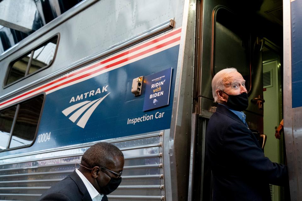 President Joe Biden boards his train at Amtrak's Pittsburgh Train Station, Wednesday, Sept. 30, 2020, in Pittsburgh. Biden took an Amtrak train tour through Ohio and Pennsylvania while campaigning for the presidency. (AP Photo/Andrew Harnik) ORG XMIT: PAAH162