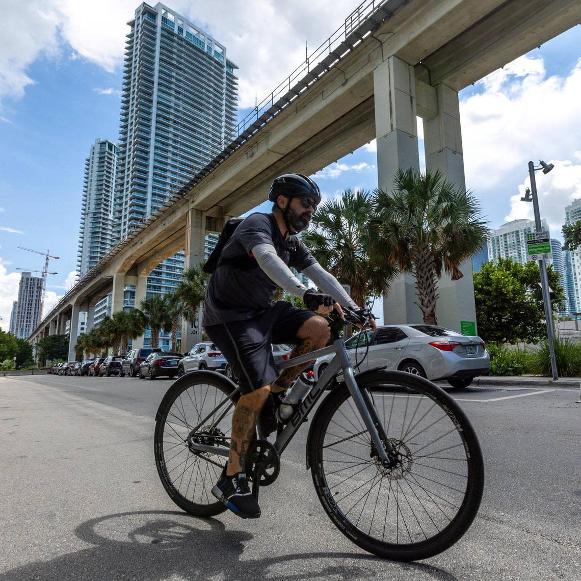 Ahol Sniffs Glue departs on his bike to find more trash to draw on to leave for fans of his artwork to find. D.A. Varela/dvarela@miamiherald.com