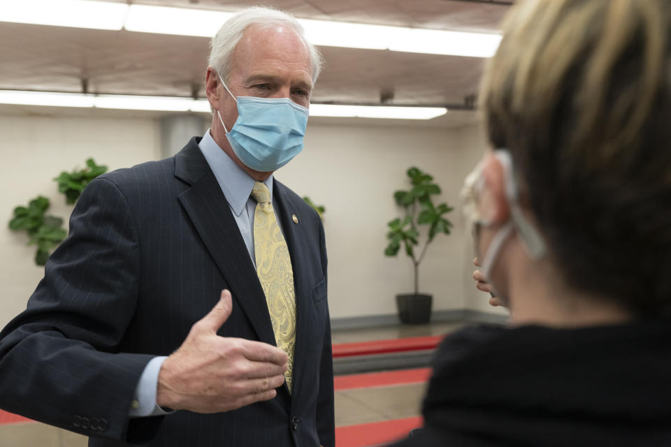 Sen. Ron Johnson, R-Wis., answers reporters after leaving the Senate floor, Tuesday, Jan. 26, 2021, on Capitol Hill in Washington. (AP Photo/Jacquelyn Martin)