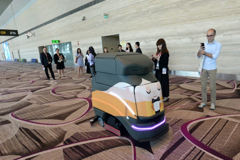 An automatic robot vacuum cleans the floor at Singapore's highly regarded Changi airport