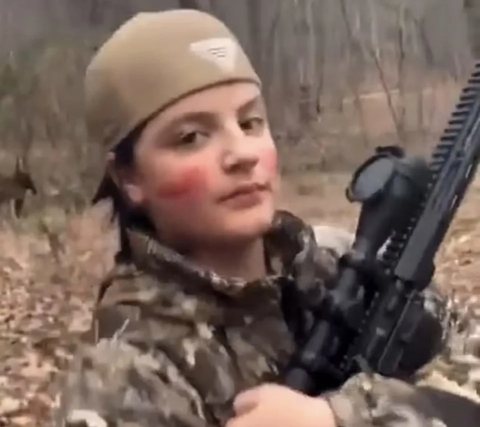 Colt Gray poses with a rifle.