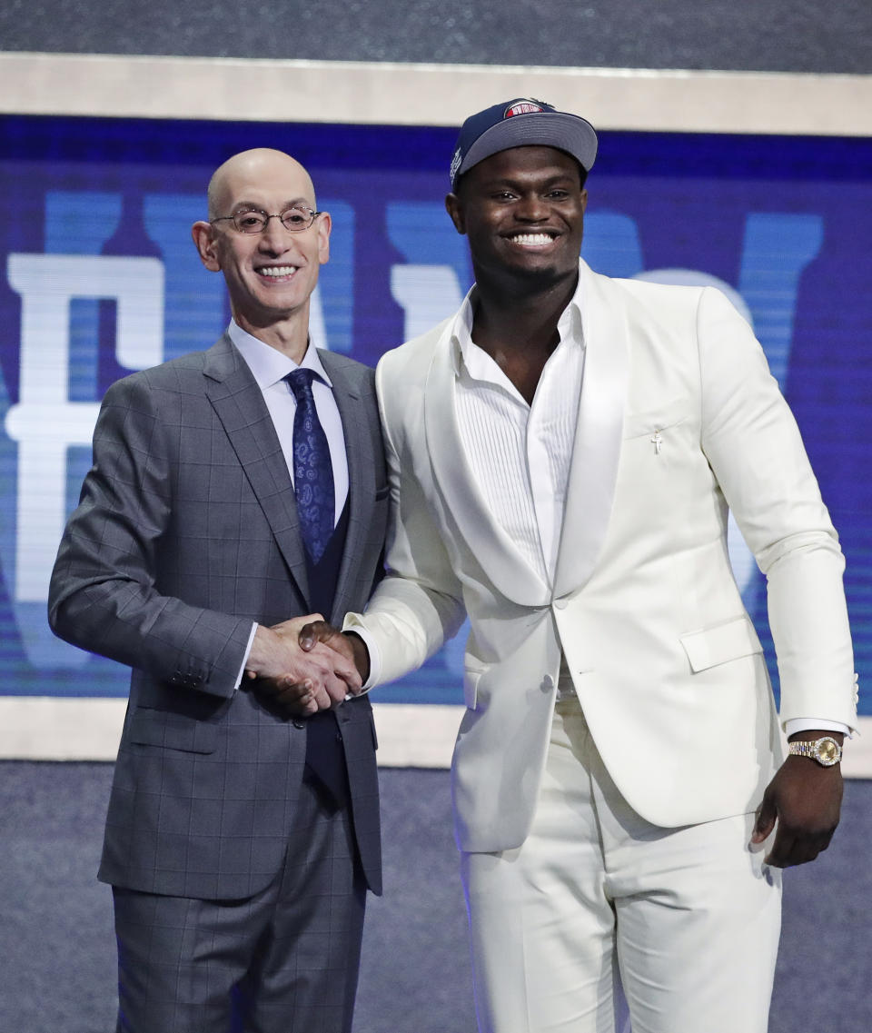 DUke's Zion Williamson, right, poses for photographs with NBA Commissioner Adam Silver after being selected by the New Orleans Pelicans with the first pick in the NBA basketball draft Thursday, June 20, 2019, in New York. (AP Photo/Julio Cortez)