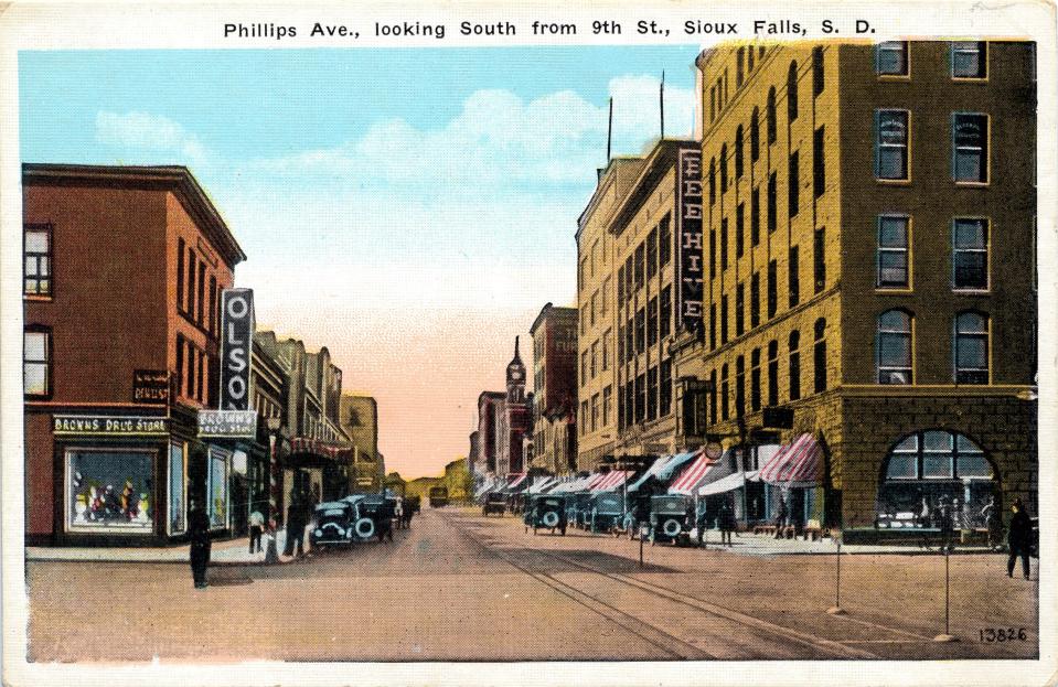 The E. C. Olson clothing store, left, is near the southeast corner of 9th and Phillips. This photo looks south on Phillips.