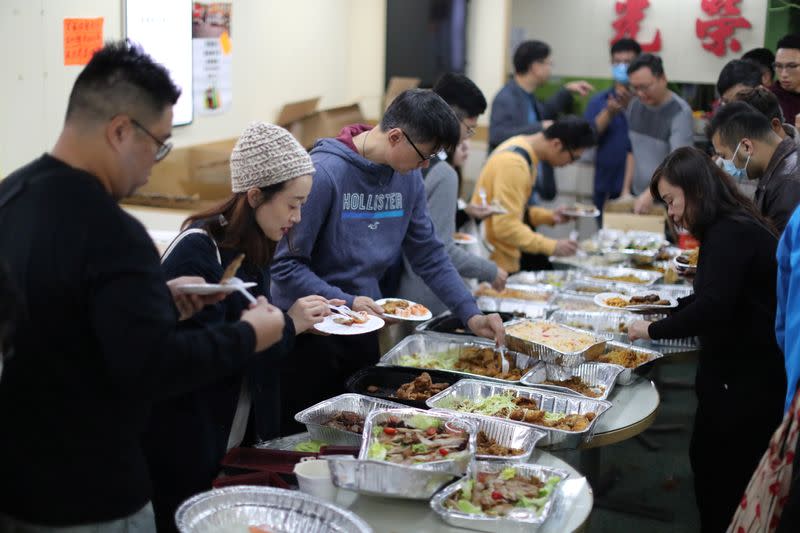 Protesters queue for a free Christmas dinner offered by a local restaurant in Hong Kong